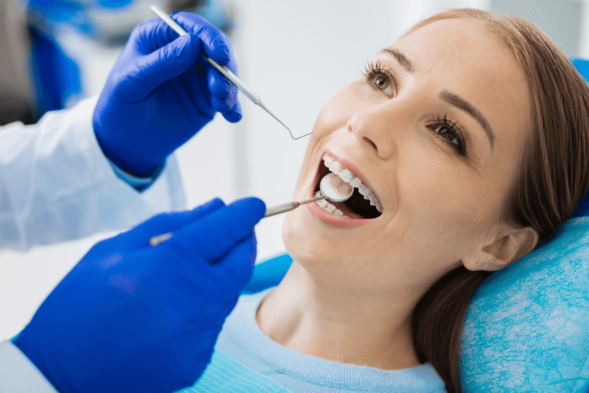 Dentist Examining Patients Teeth